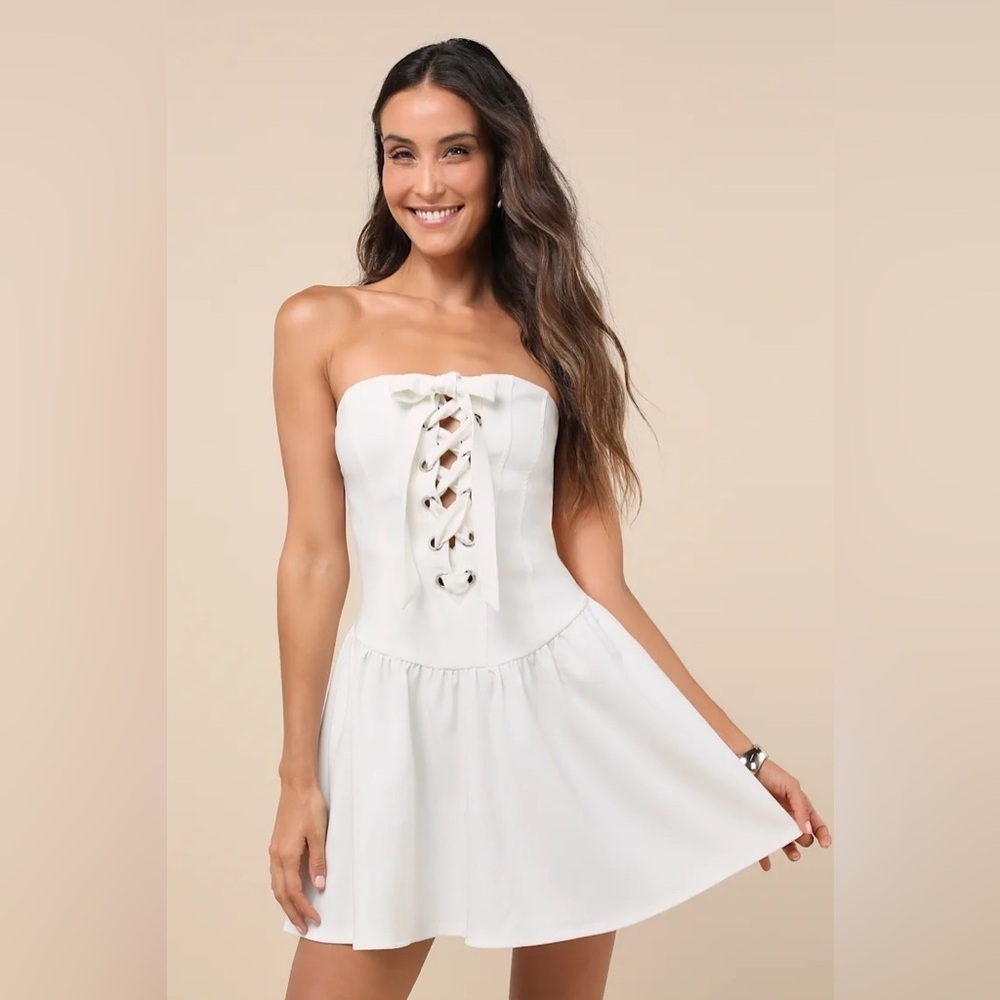 Infinite Allure White Strapless Lace-Up Drop
Waist Mini Dress